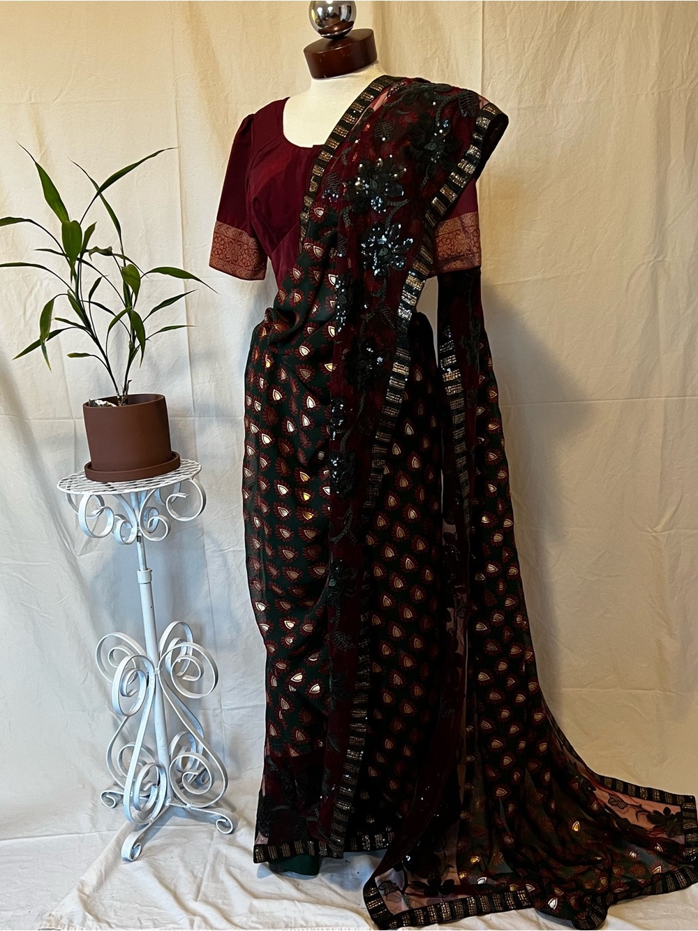Elegant Maroon, Green  and Black Embellished Saree